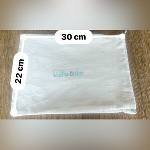Stella & Dot Cream Pouch with embroidered  teal  Logo and teal draw string